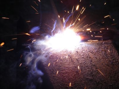 Arc welding in progress with sparks